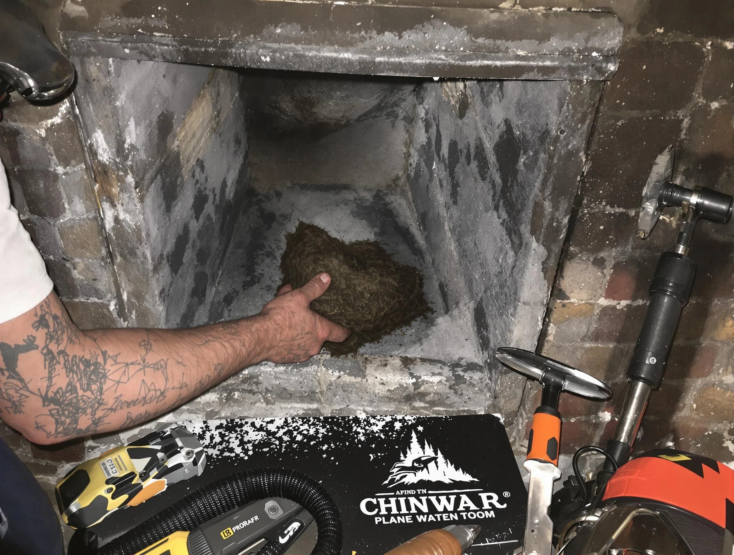 Dunwoody Chimney Sweep safely removing debris and screening chimney in Dunwoody, GA